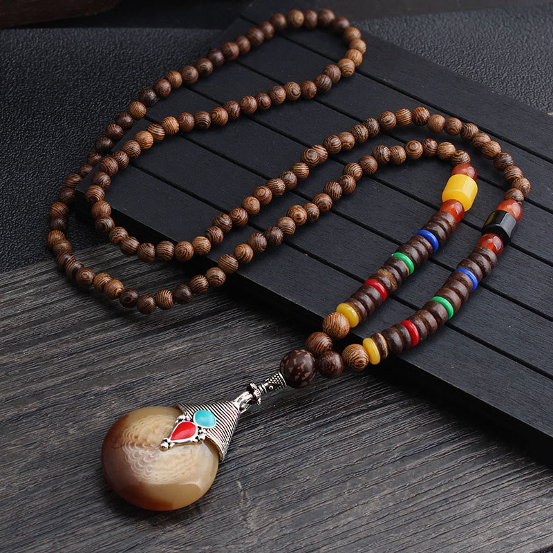 Collier d'équilibre en bois de wengé et agate pour la paix et la protection