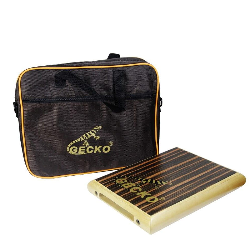 Gecko black carrying case with yellow trim beside a wooden Cajon Box Drum Set