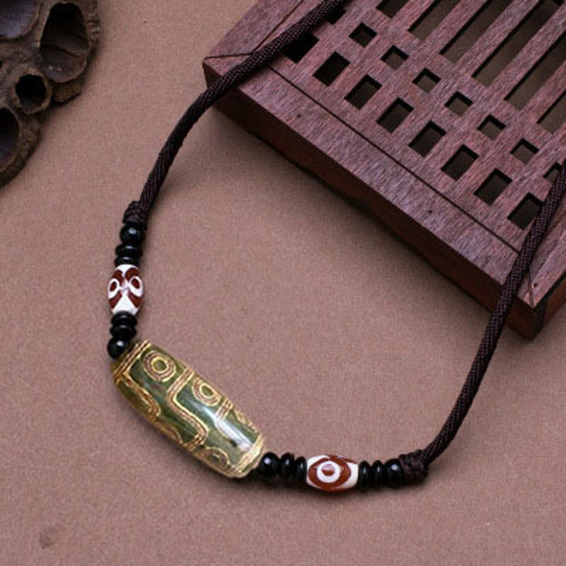 Collier unisexe en perles dzi à neuf yeux | Protection en agate
