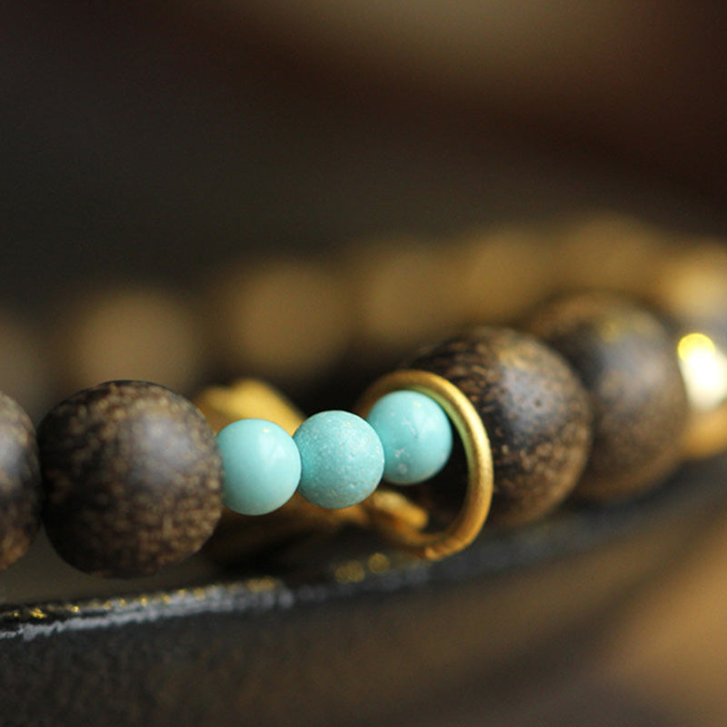 Bracelet de force en bois d'agar et lotus pour l'équilibre et le calme