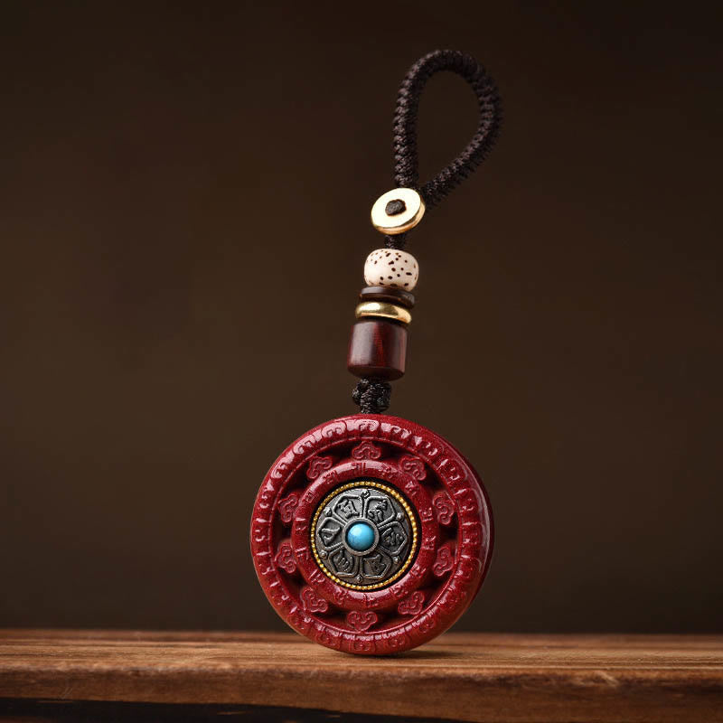 Collier pendentif rotatif et porte-clés Cinabre Om Mani Padme Hum