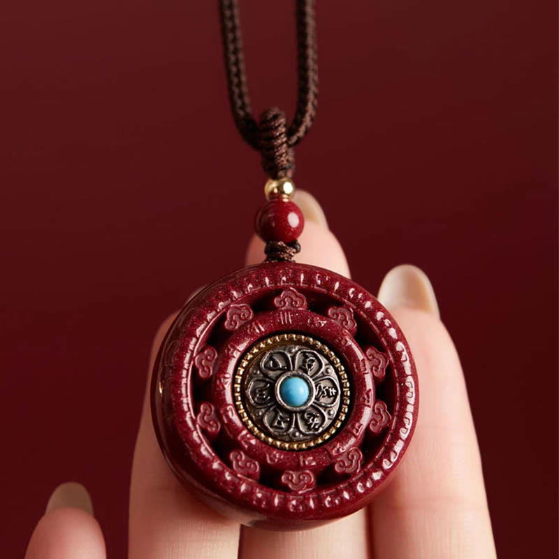 Collier pendentif rotatif et porte-clés Cinabre Om Mani Padme Hum