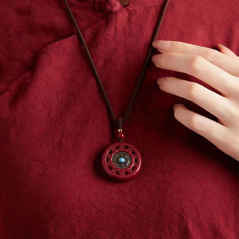 Collier pendentif rotatif et porte-clés Cinabre Om Mani Padme Hum