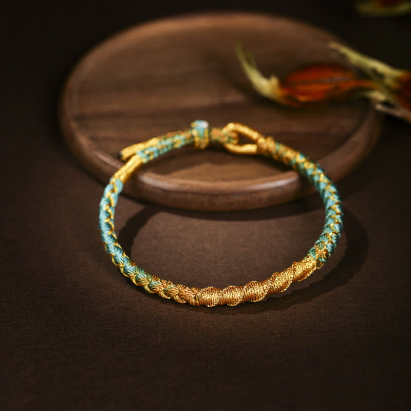 Bracelet en fil d'or coloré avec nœud en écailles de dragon tibétain et cordon rouge