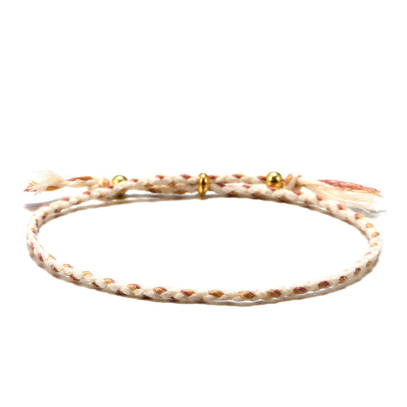 Bracelet d'harmonie coloré fait main avec pompon en corde réglable