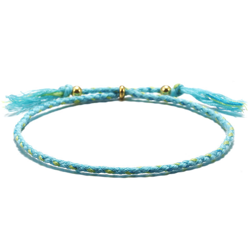 Bracelet d'harmonie coloré fait main avec pompon en corde réglable