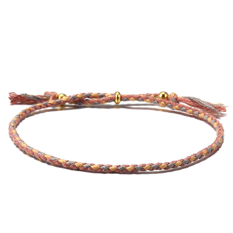 Bracelet d'harmonie coloré fait main avec pompon en corde réglable