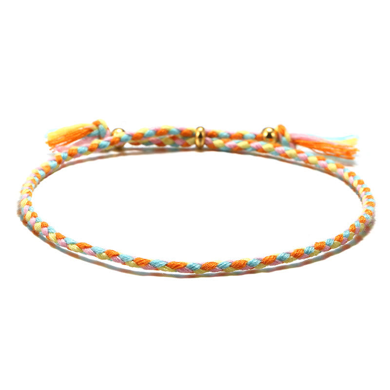 Bracelet d'harmonie coloré fait main avec pompon en corde réglable