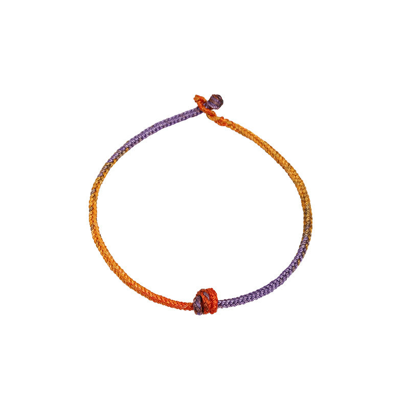 Bracelet en corde tressée colorée violette, dorée et rouge pour l'équilibre