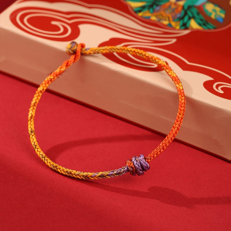 Bracelet en corde tressée colorée violette, dorée et rouge pour l'équilibre