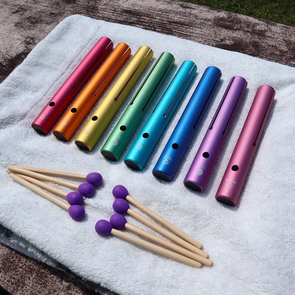 Rainbow metal chimes with purple mallets for Complete Chakra Solfeggio healing