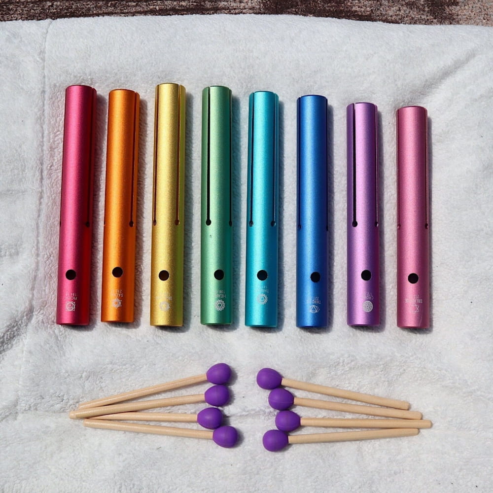 Rainbow-colored metal chimes with purple mallets from Complete Chakra Solfeggio Tubes