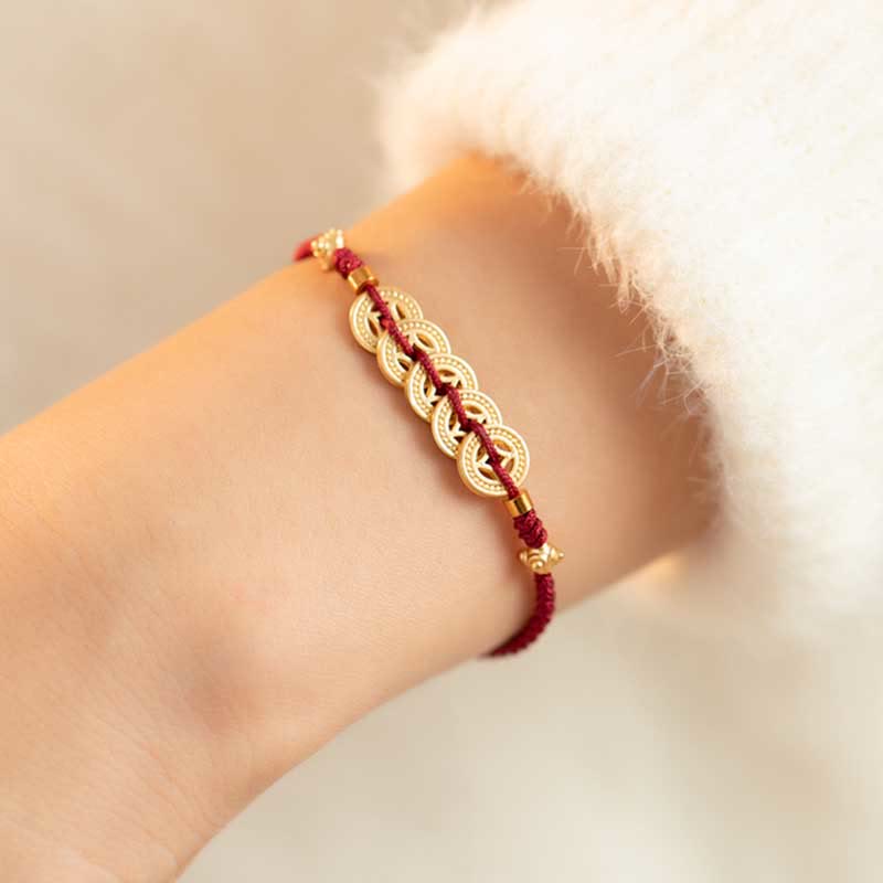 Bracelet en fil rouge avec pièce de cuivre pour la chance et la protection