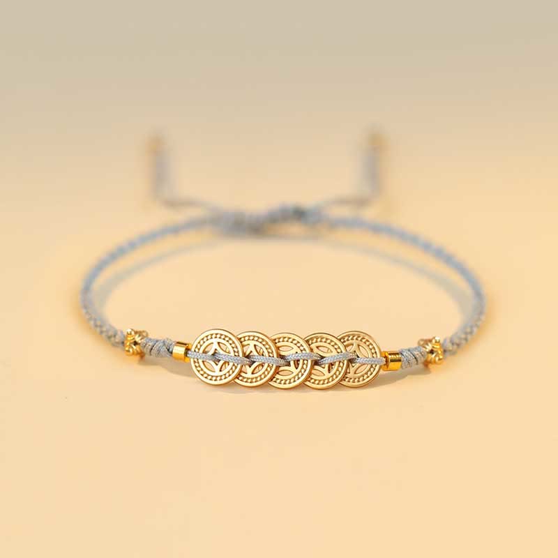 Bracelet en fil rouge avec pièce de cuivre pour la chance et la protection