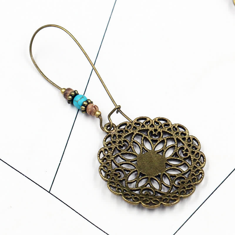 Boucles d'oreilles spirituelles en cuivre avec motif floral pour la chance et l'abondance