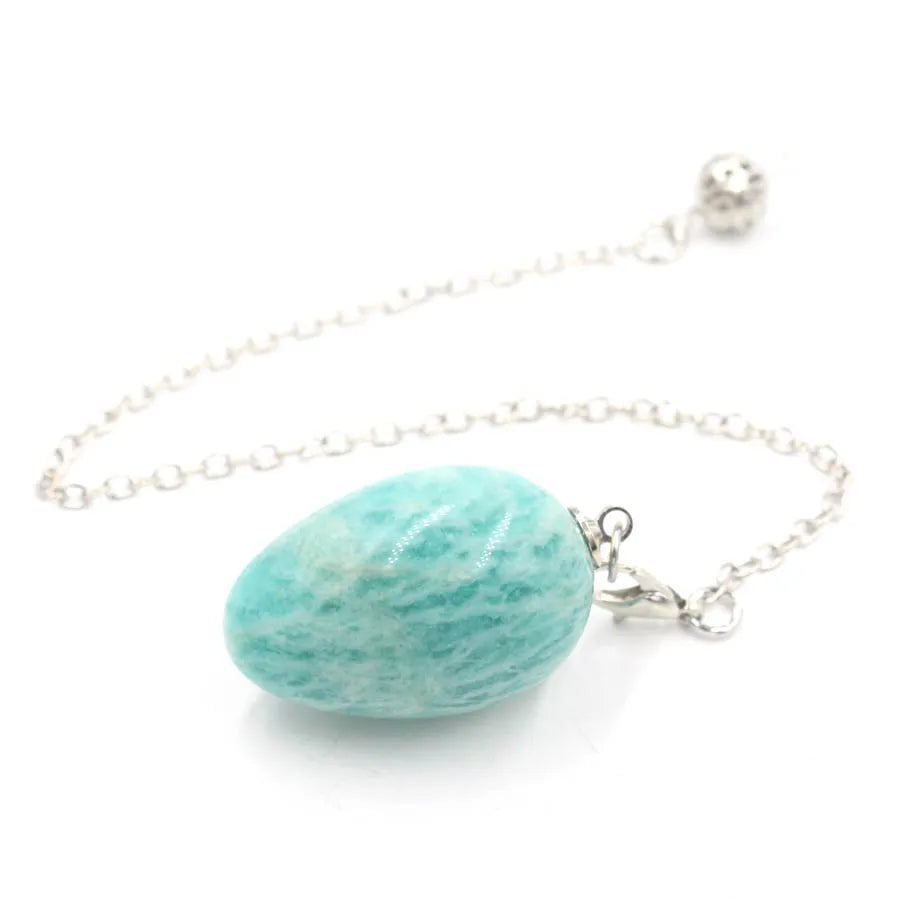 Pendule en forme d'œuf de cristal : quartz rose et plus