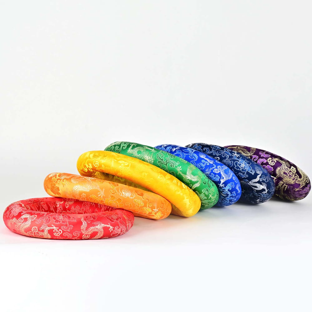 Rainbow-colored pool noodles in a curved line for Crystal Singing Bowl cushion holder