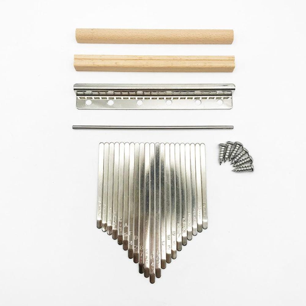 Disassembled Kalimba thumb piano parts including metal tines and wooden pieces