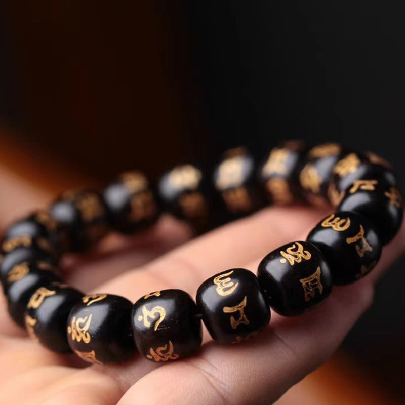 Bracelet de paix Om Mani Padme Hum en bois d'ébène pour l'équilibre