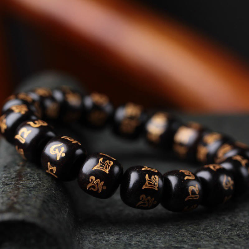 Bracelet de paix Om Mani Padme Hum en bois d'ébène pour l'équilibre