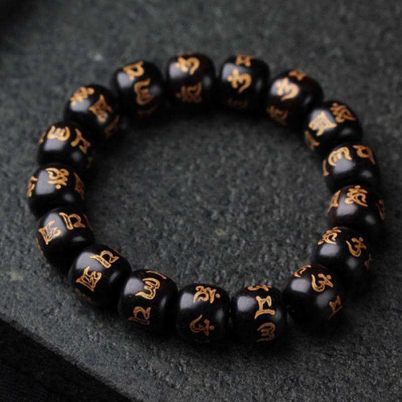 Bracelet de paix Om Mani Padme Hum en bois d'ébène pour l'équilibre