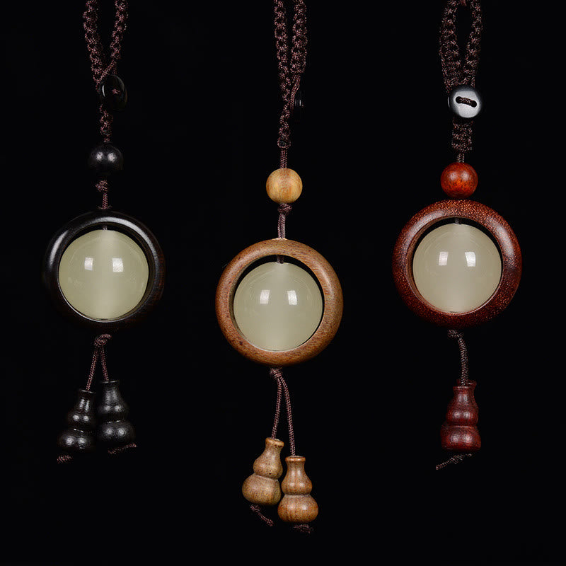 Porte-clés en bois d'ébène « Paix » | Perles lumineuses en bois de santal rouge et vert