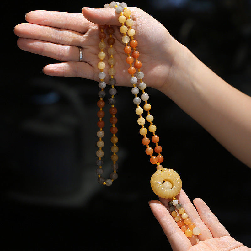 Collier pendentif en jade et soie dorée | Porte-bonheur