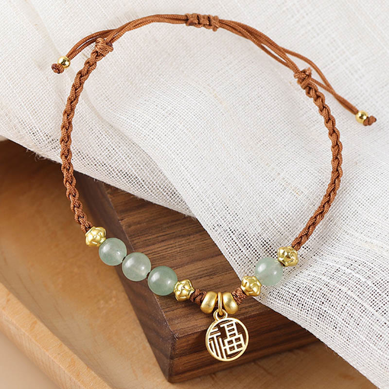 Bracelet en perles de jade avec le personnage Fu pour la prospérité et la chance