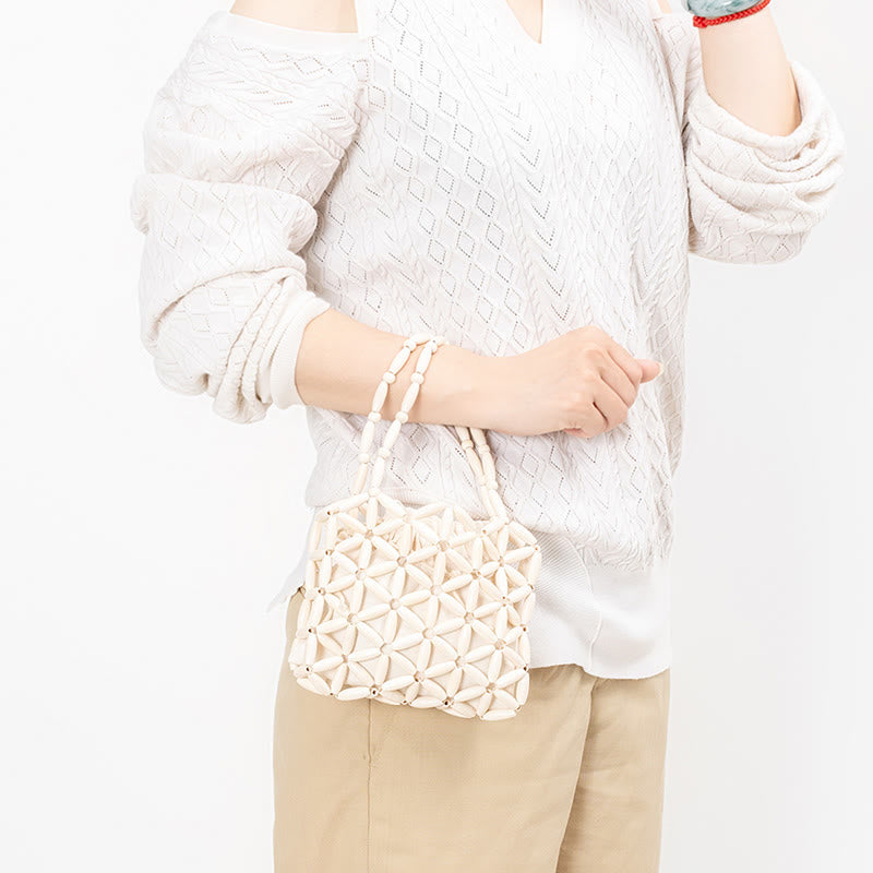 Sac à bijoux spirituel en mini perles de bois tissées à la main