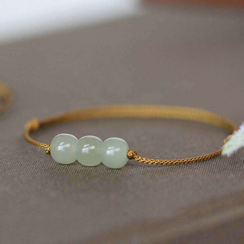Bracelet porte-bonheur en jade à trois perles tissées