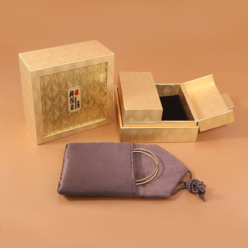 Coffret à bijoux zen doré à motif plumes