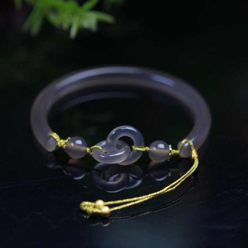 Bracelet spirituel en agate grise avec boucle de paix pour l'équilibre