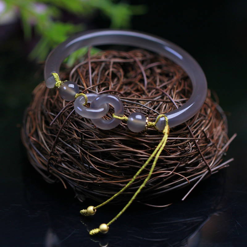 Bracelet spirituel en agate grise avec boucle de paix pour l'équilibre