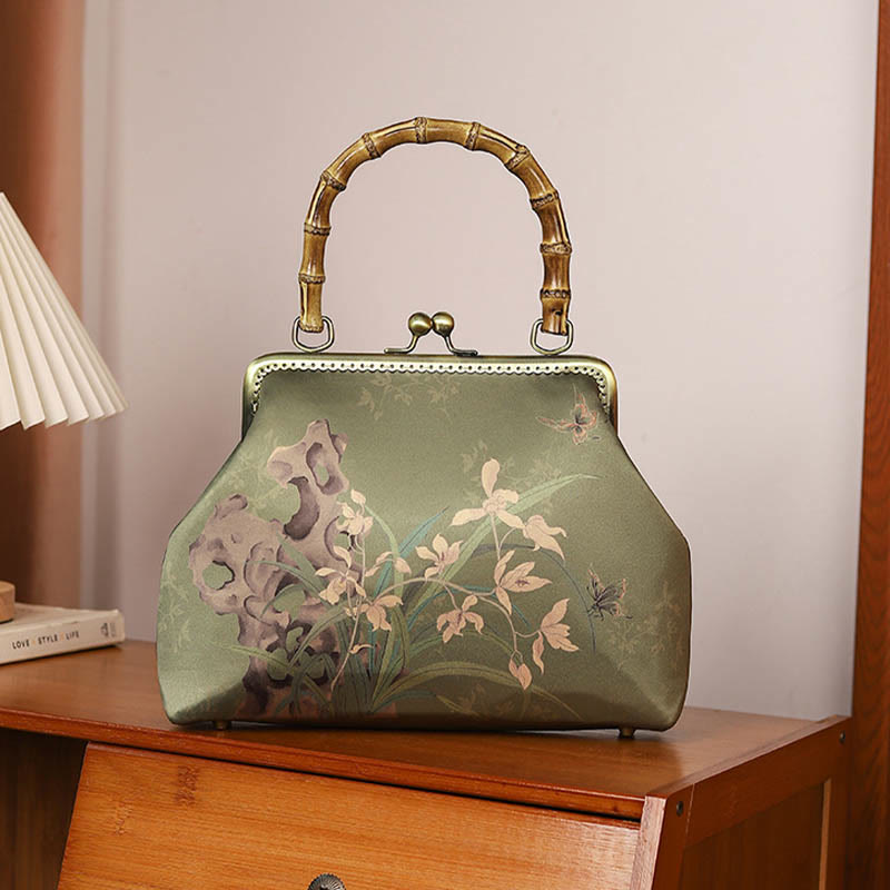 Sac à bandoulière avec poignée en bambou et plantes vertes