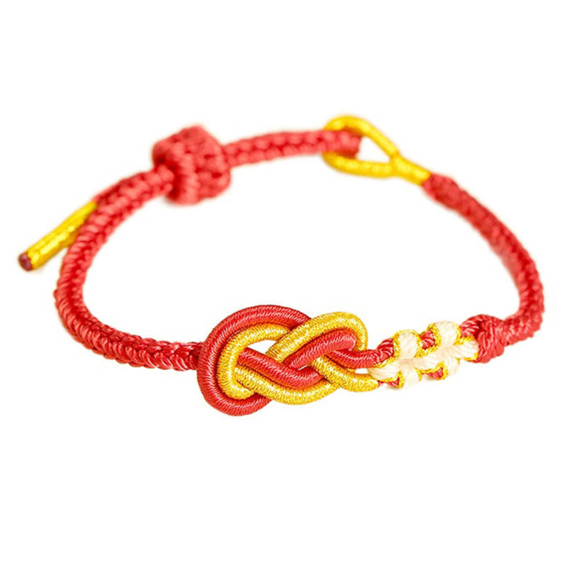 Bracelet artisanal à huit fils rouges avec nœud de paix