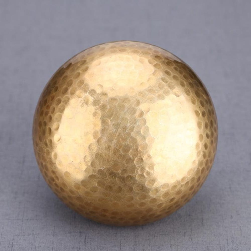 Hammered gold metallic sphere with dimpled texture for Handcrafted Tibetan Singing Bowl