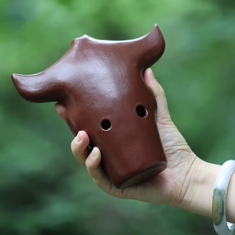 Brown ceramic bull head detail of Handmade 10-Hole Ceramic Chinese Xun Instrument