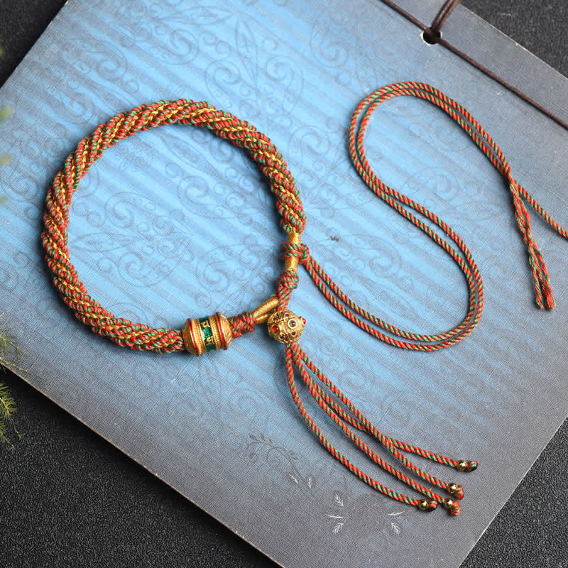 Bracelet tibétain fait main avec roue de prière porte-bonheur en fil rouge