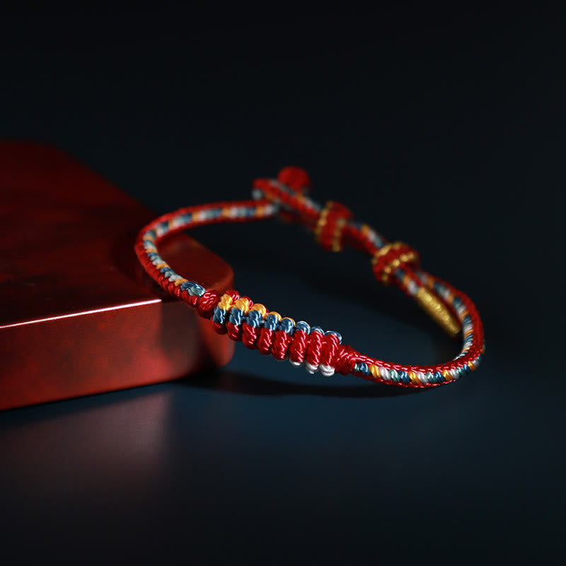 Bracelet de protection tibétain fait main en fil rouge