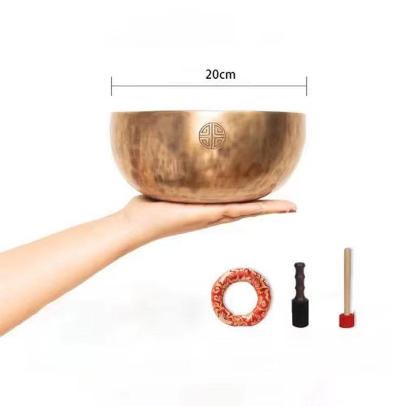 Bronze Tibetan singing bowl with etched design for meditation and yoga use