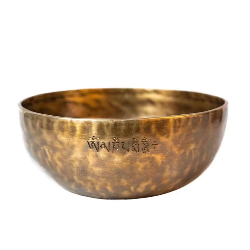 Hammered bronze Tibetan singing bowl with Sanskrit etching for meditation and yoga