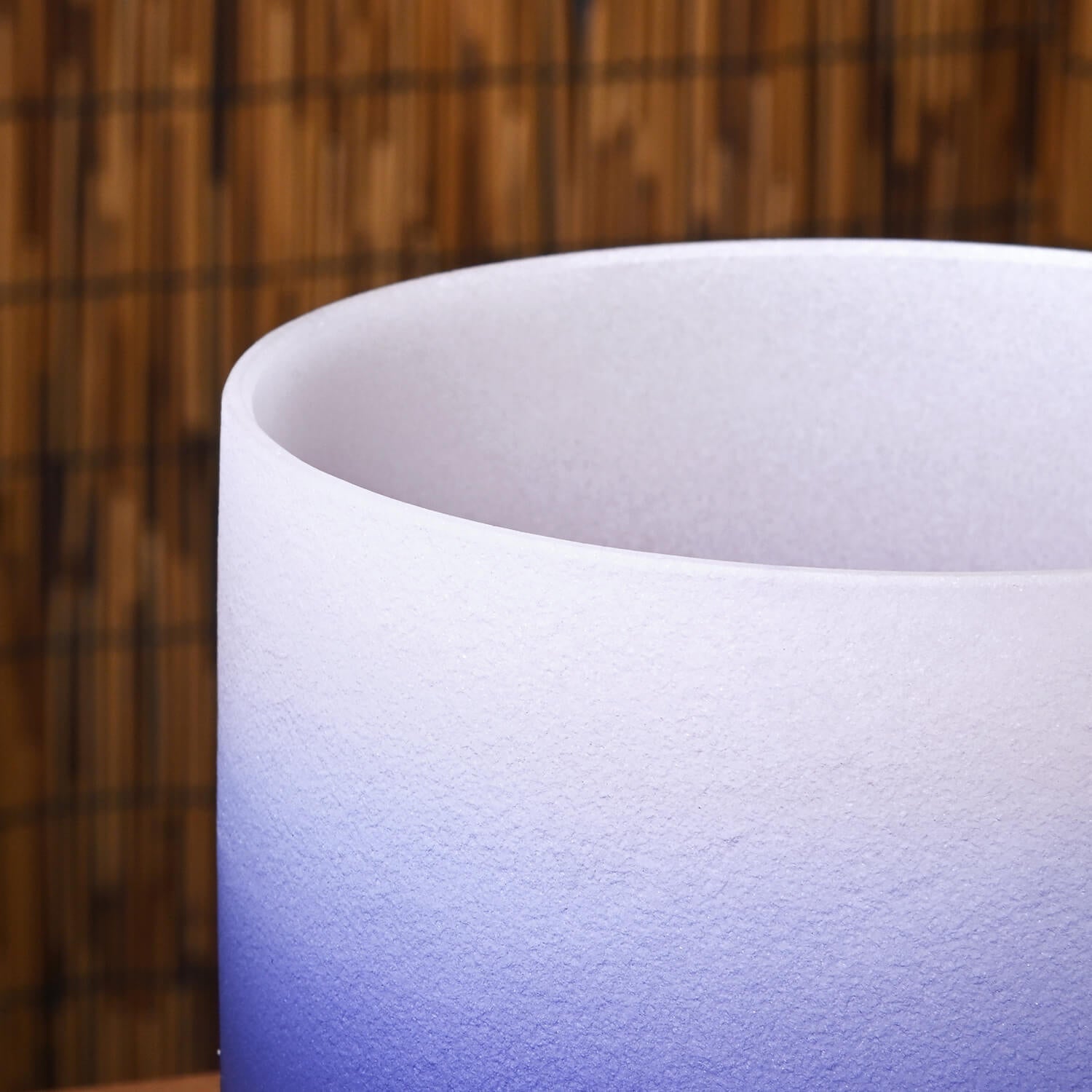 White and blue gradient cylindrical vessel with frosted texture for Indigo Aria singing bowl