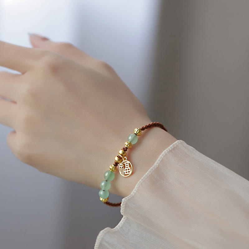 Bracelet en perles de jade avec le personnage Fu pour la prospérité et la chance