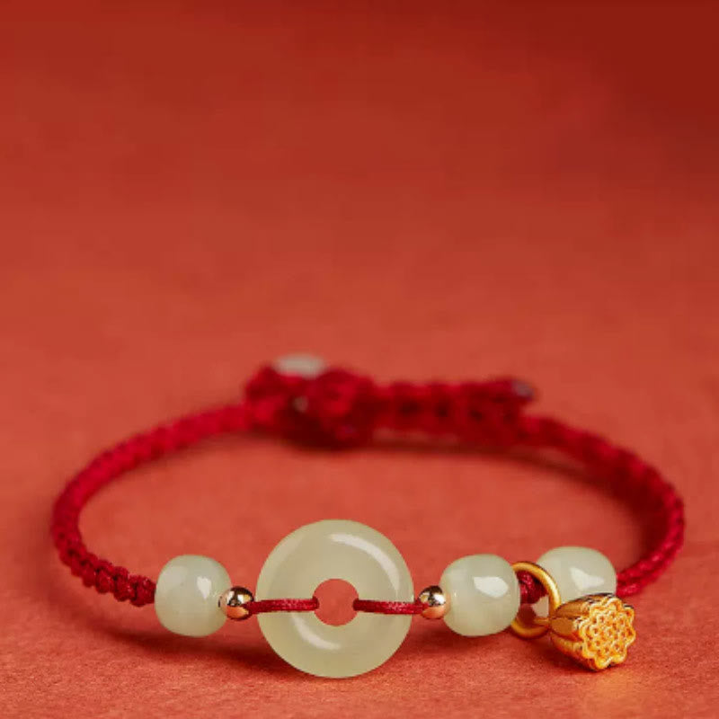 Bracelet en fil de jade et lotus de paix pour l'abondance