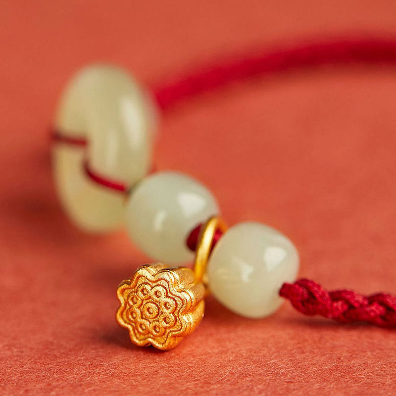 Bracelet en fil de jade et lotus de paix pour l'abondance