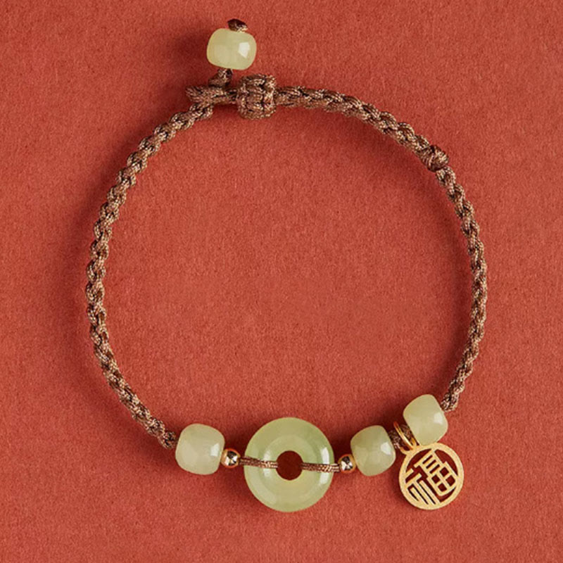 Bracelet en fil de jade et lotus de paix pour l'abondance