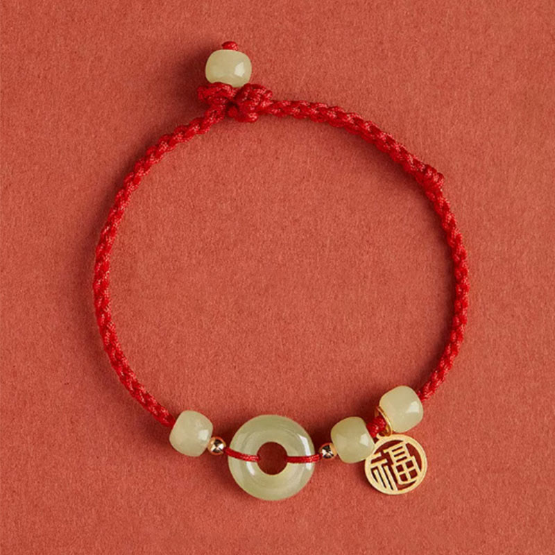 Bracelet en fil de jade et lotus de paix pour l'abondance