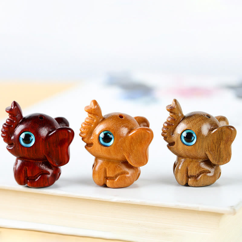 Mini éléphant sculpté en bois de santal pour la protection et la chance