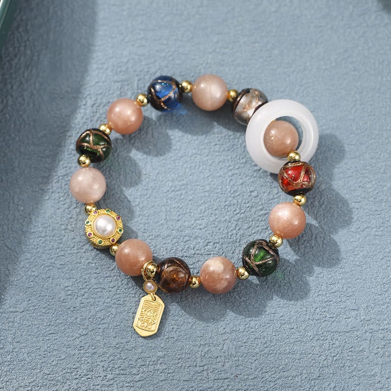 Bracelet Om Mani Padme Hum Om avec Tridacna et pierres de soleil 14-16 cm