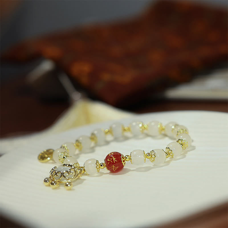 Bracelet de bénédiction en agate rouge avec le personnage Fu pour la protection